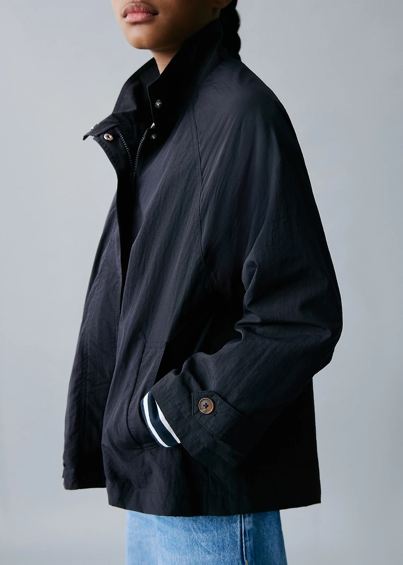 Trench coat with button detail