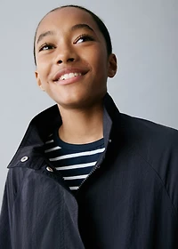 Trench coat with button detail