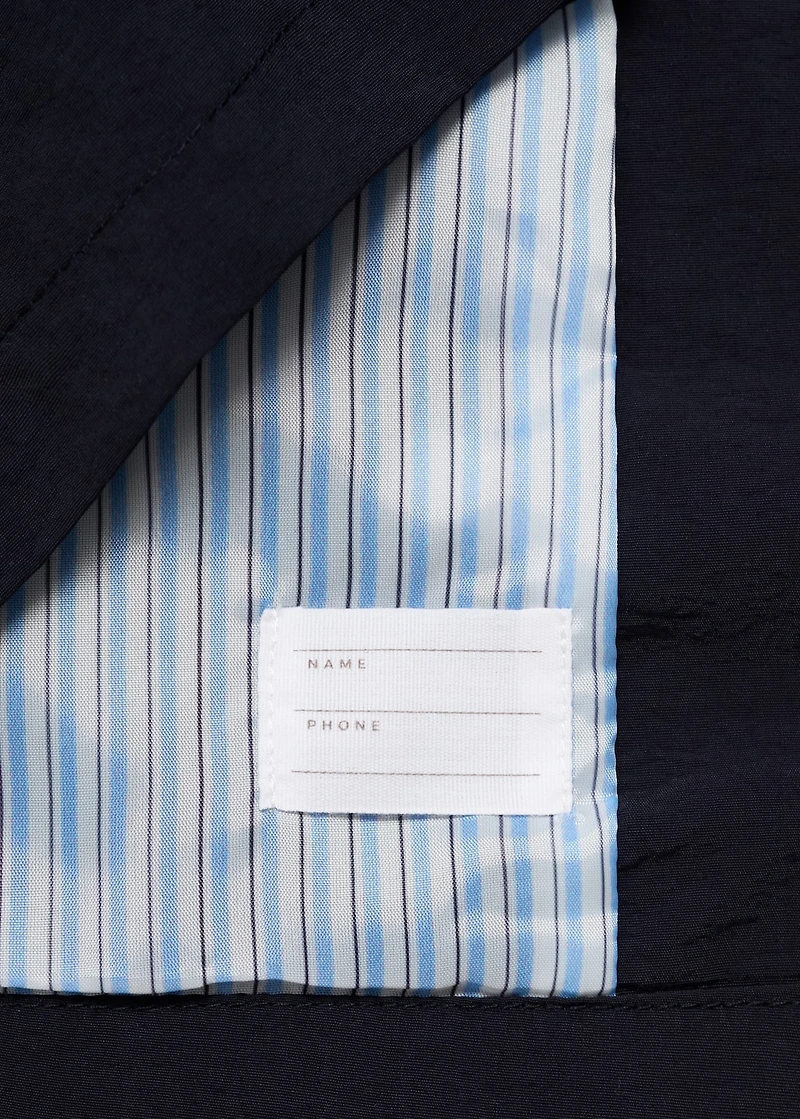 Trench coat with button detail