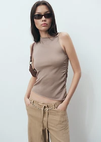 Asymmetrical knitted top with straps