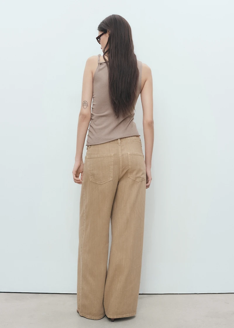 Asymmetrical knitted top with straps