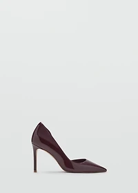 Asymmetrical patent leather court shoes