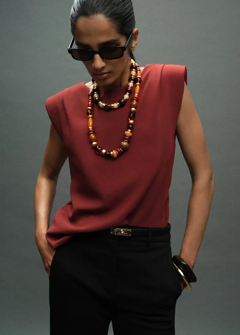 Ruched blouse with shoulder pads