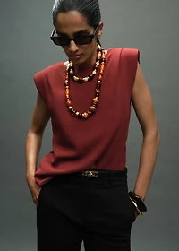 Ruched blouse with shoulder pads