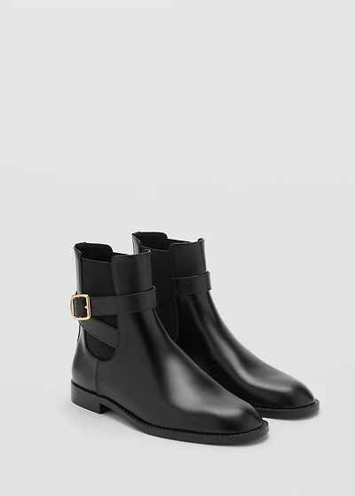 Ankle boots with elastic panel and buckle