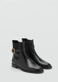 Ankle boots with elastic panel and buckle