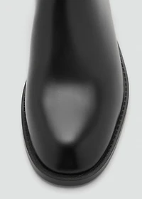 Ankle boots with elastic panel and buckle