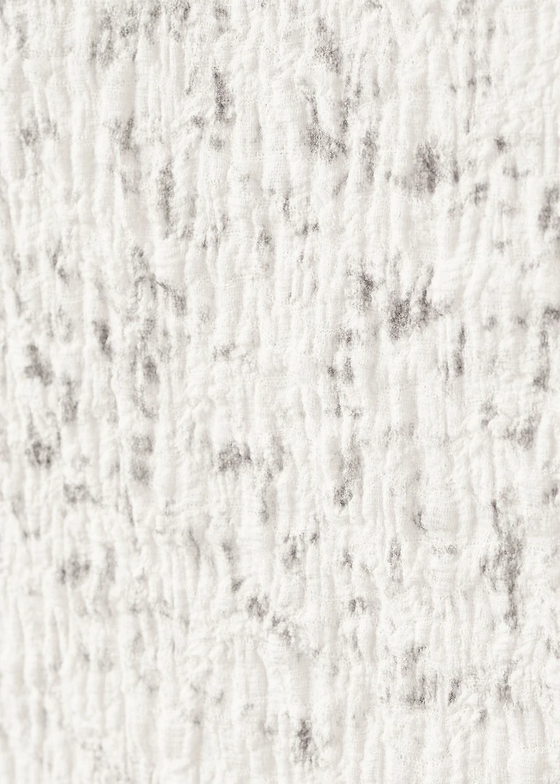 Speckled t-shirt with an asymmetrical neckline