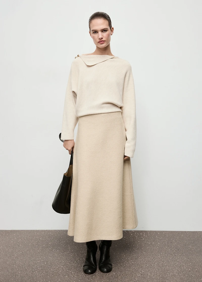 Sweater with asymmetrical neck and jewel buttons