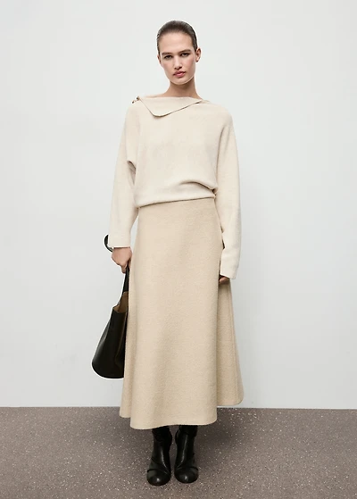 Sweater with asymmetrical neck and jewel buttons