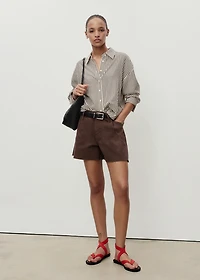 Denim shorts with frayed hem and pleats