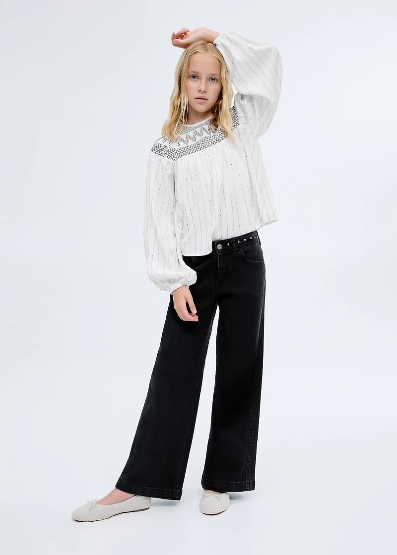 Low-waist studded jeans