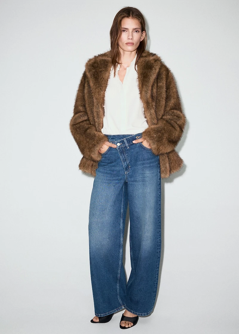 Wide-leg mid-rise jeans with a crossover waistband