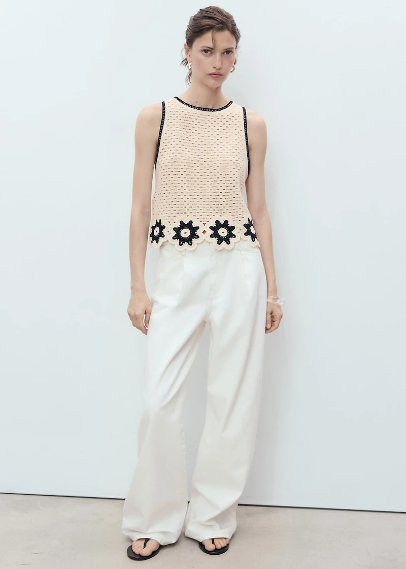 Crochet top with floral finishes