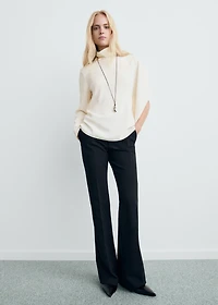 High-neck blouse with asymmetrical sleeves