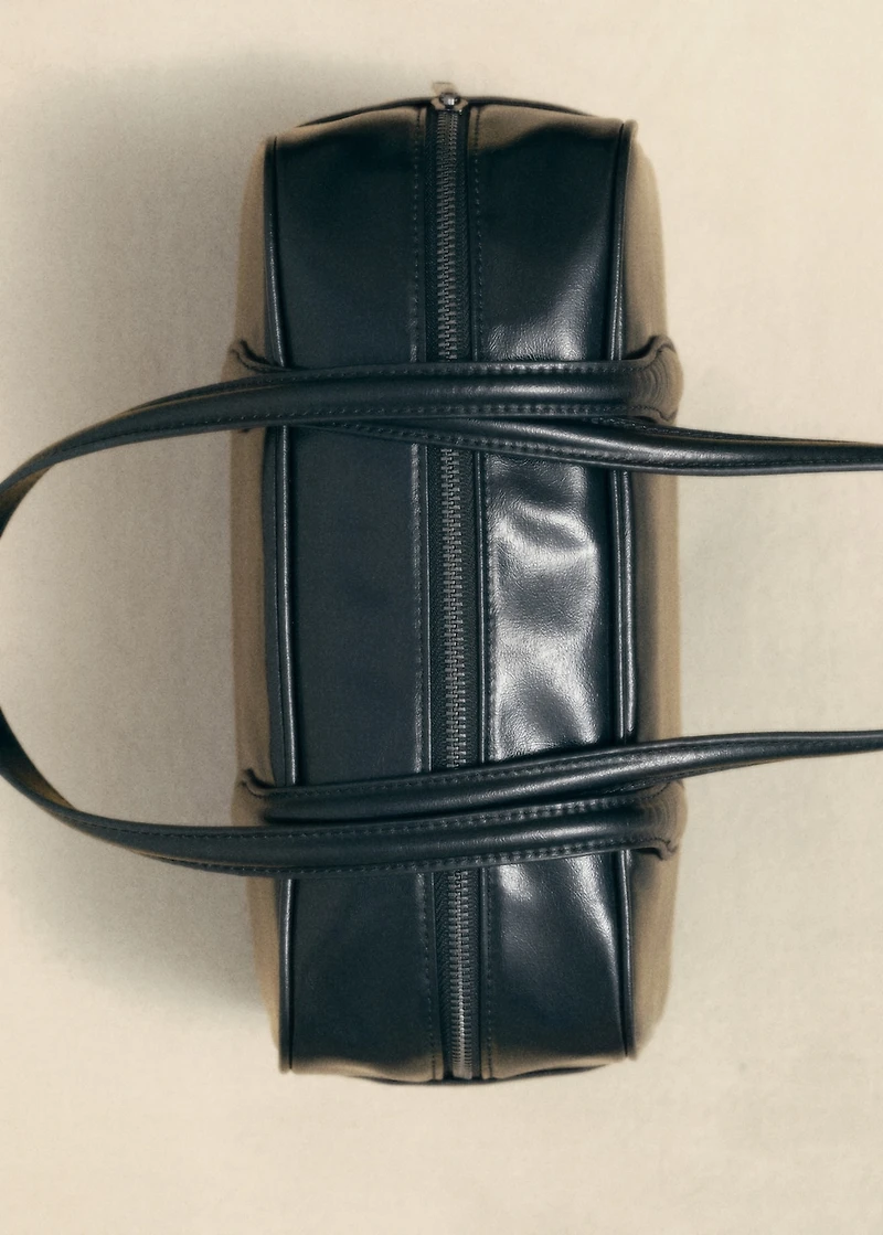 Bowling bag with faux-leather finish