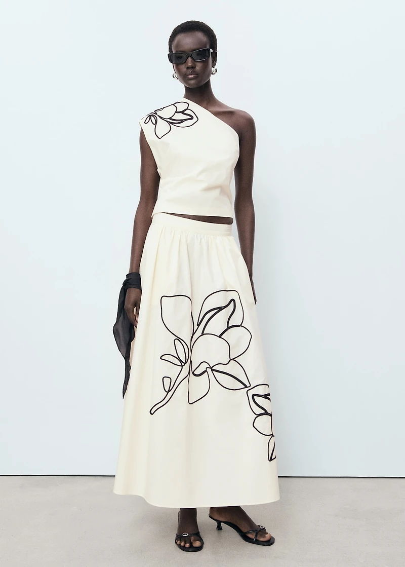 Asymmetrical flower-embroidered top