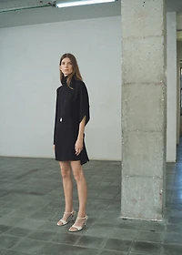 Turtleneck dress with asymmetrical sleeves