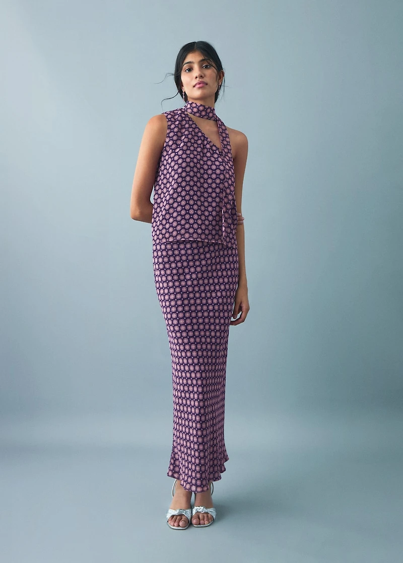 Asymmetrical blouse with bow at the neck