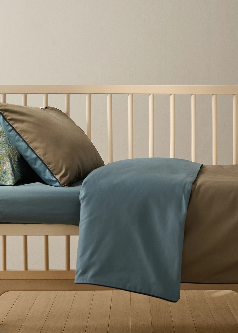 Reversible percale cotton duvet cover with contrasting piping for cot