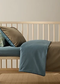 Reversible percale cotton duvet cover with contrasting piping for cot