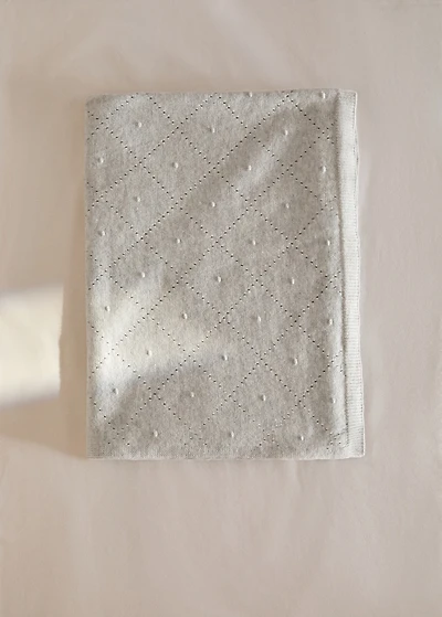 Embroidered children’s blanket with rhombus design