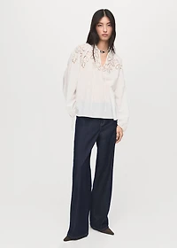 Embroidered blouse with bows
