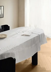 Hand-embroidered oval linen tablecloth for 6 to 8 diners
