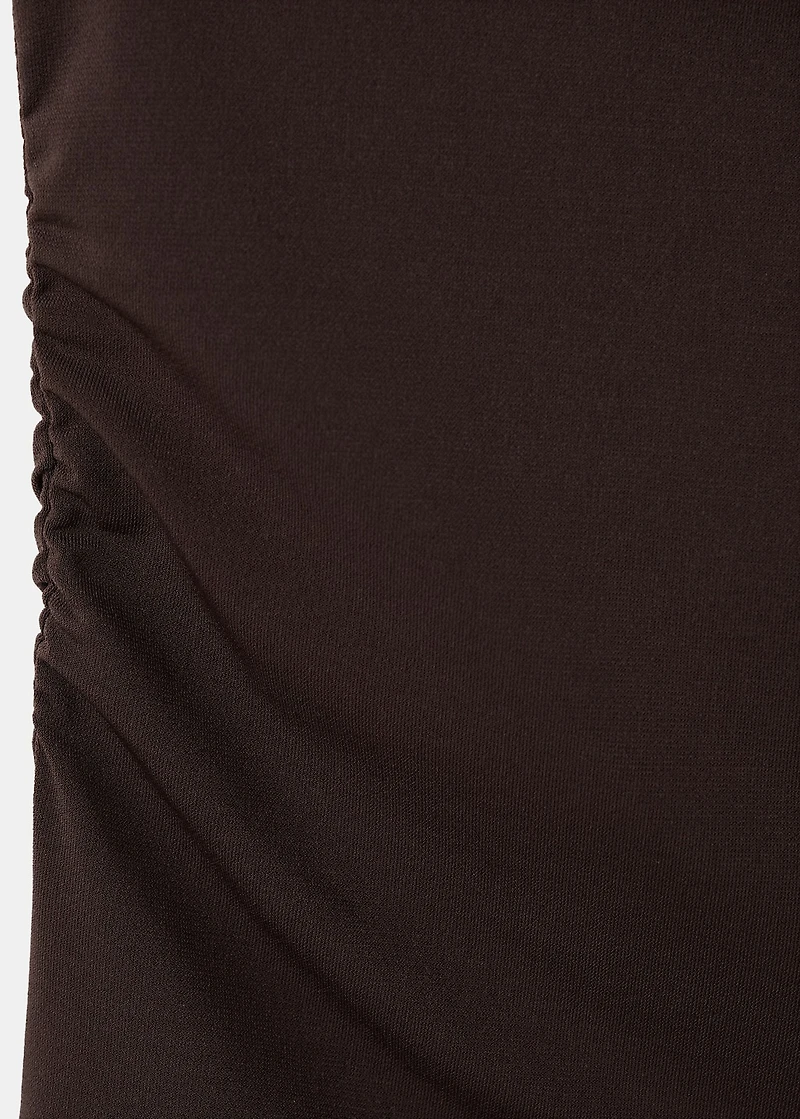 Top with asymmetrical neckline and metallic detail