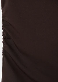 Top with asymmetrical neckline and metallic detail