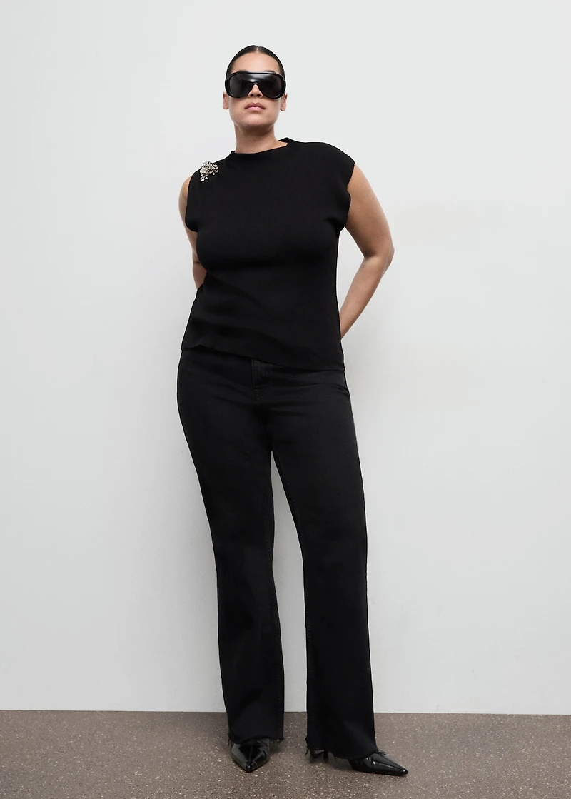 Knitted top with metallic flower