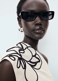 Asymmetrical flower-embroidered top