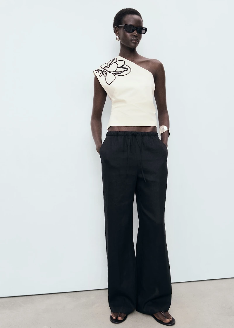 Asymmetrical flower-embroidered top