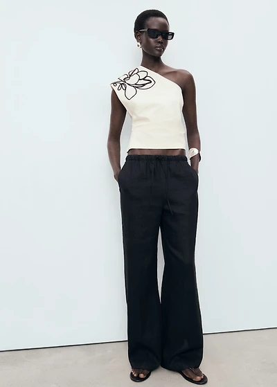 Asymmetrical flower-embroidered top
