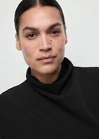 Jumpsuit with draped neck and belt