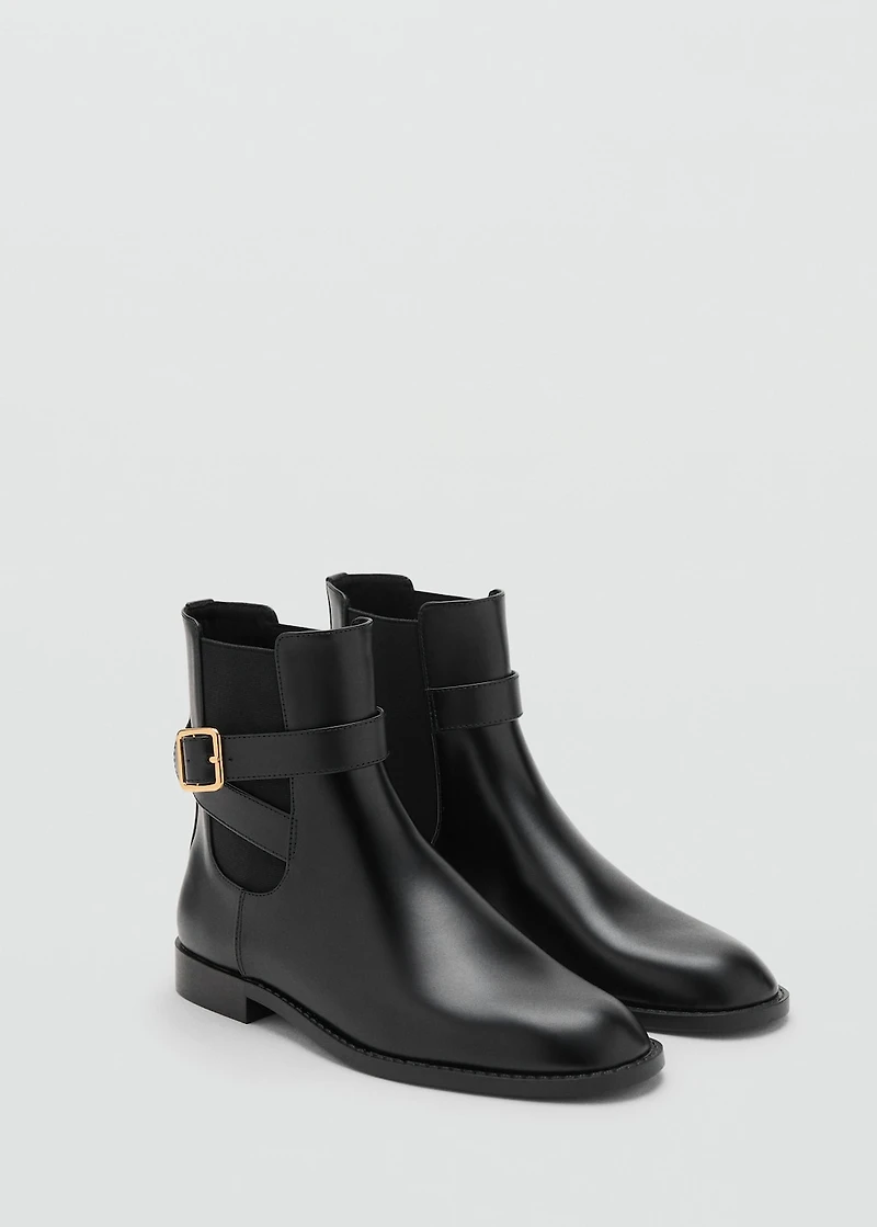 Ankle boots with elastic panel and buckle