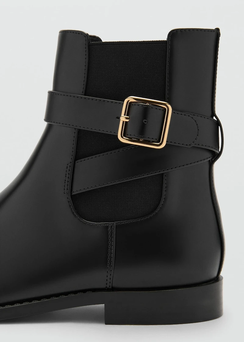Ankle boots with elastic panel and buckle