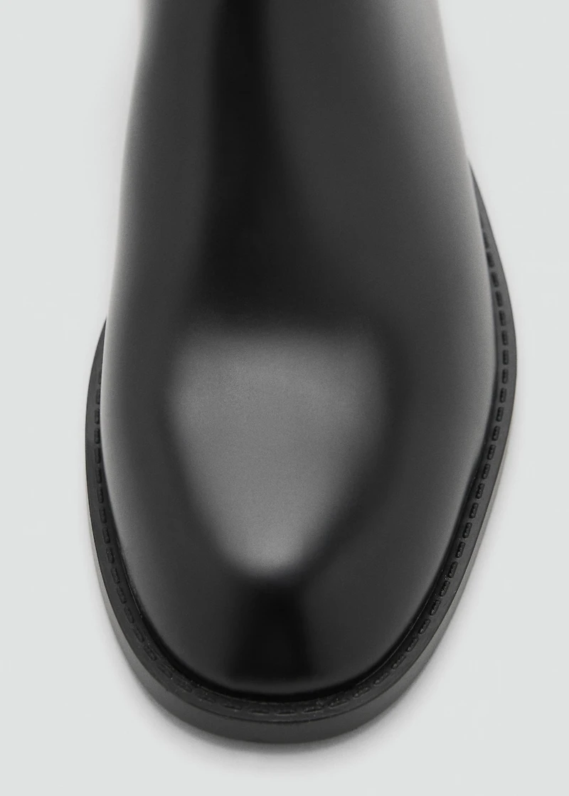 Ankle boots with elastic panel and buckle