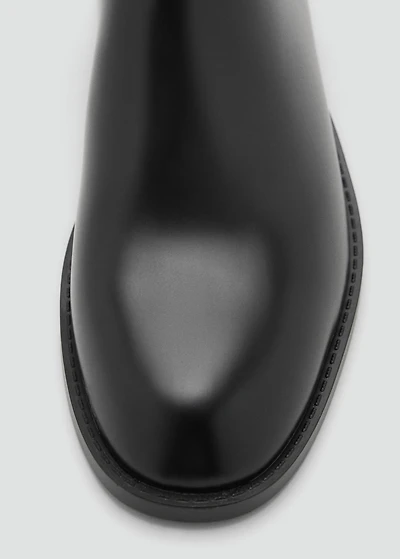 Ankle boots with elastic panel and buckle