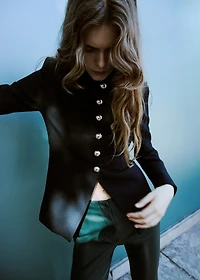 Faux-leather flared trousers