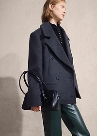 Faux-leather flared trousers