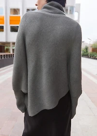 Sweater with asymmetrical roll neck