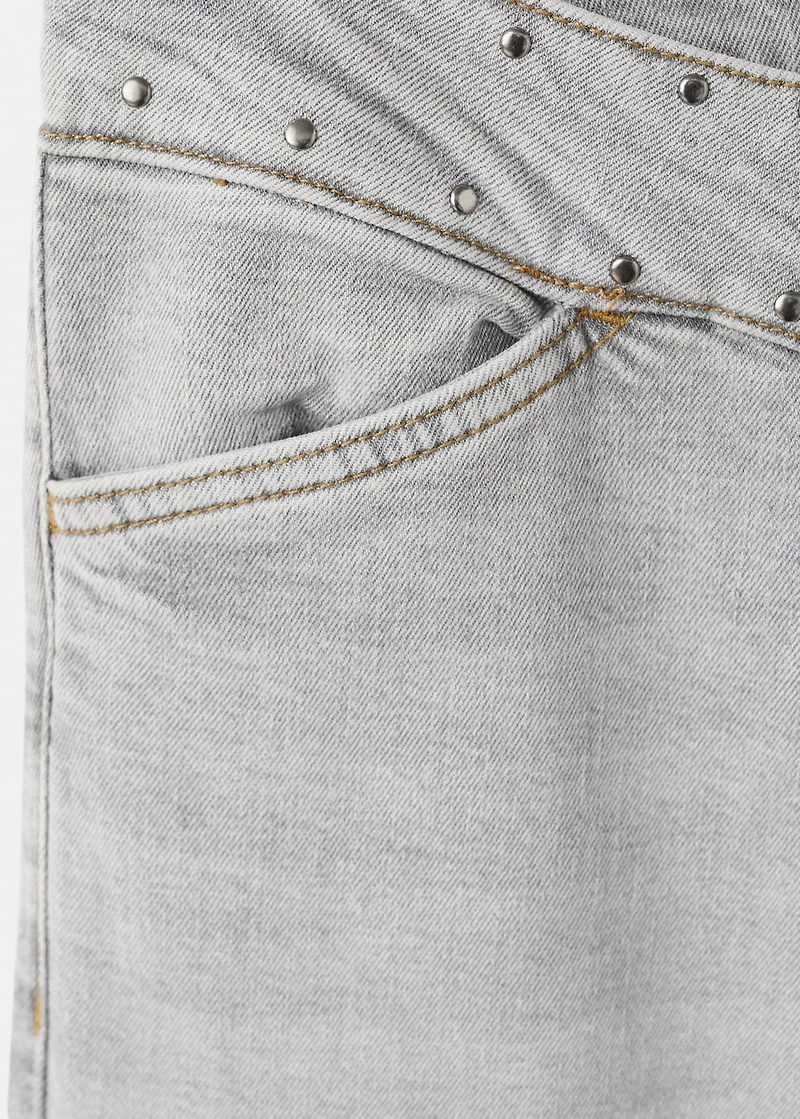 Low-waist studded jeans