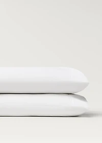 Two 500-thread count cotton percale pillowcases with rounded piping detail 50x75 cm