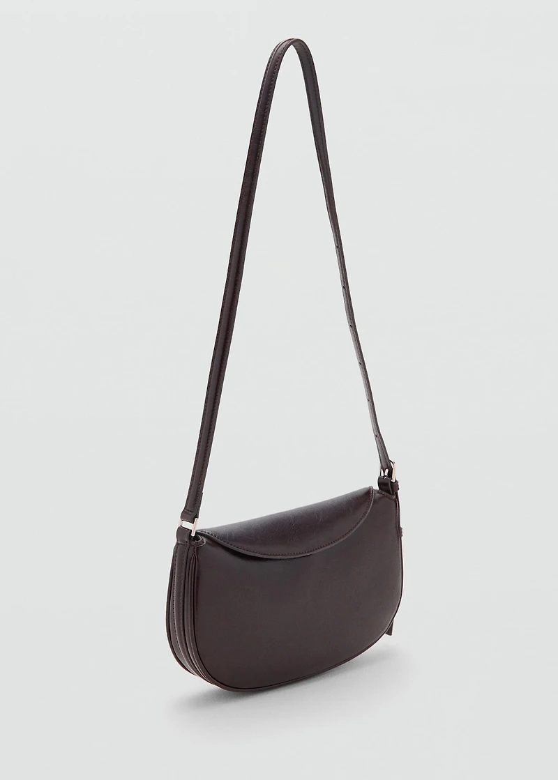 Oval shoulder bag with flap