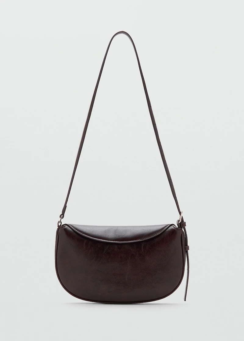 Oval shoulder bag with flap
