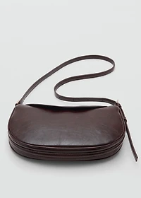 Oval shoulder bag with flap