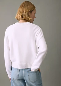 Knitted sweater with seams