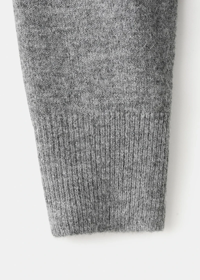 Asymmetrical studded sweater