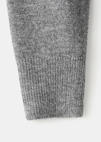 Asymmetrical studded sweater